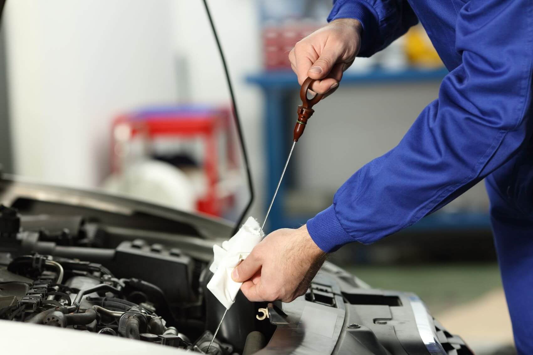 Ford certified technician changing oil at Houston, TX service center