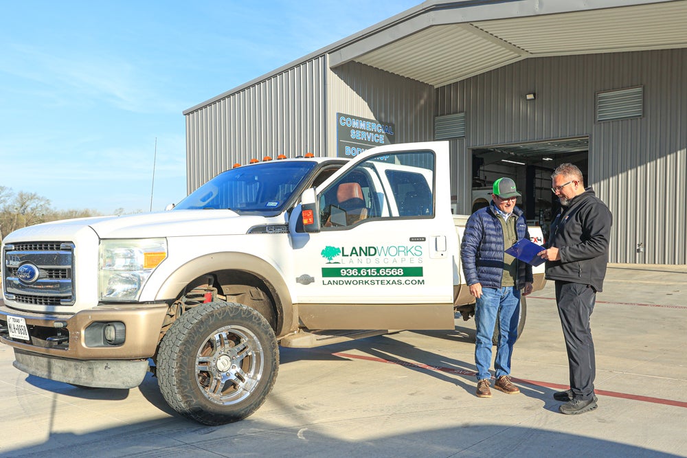 Tipton Ford team speaks with a commercial fleet client.